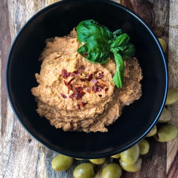 Tangy Tomato and Olive chickpea Hummus in a bowl