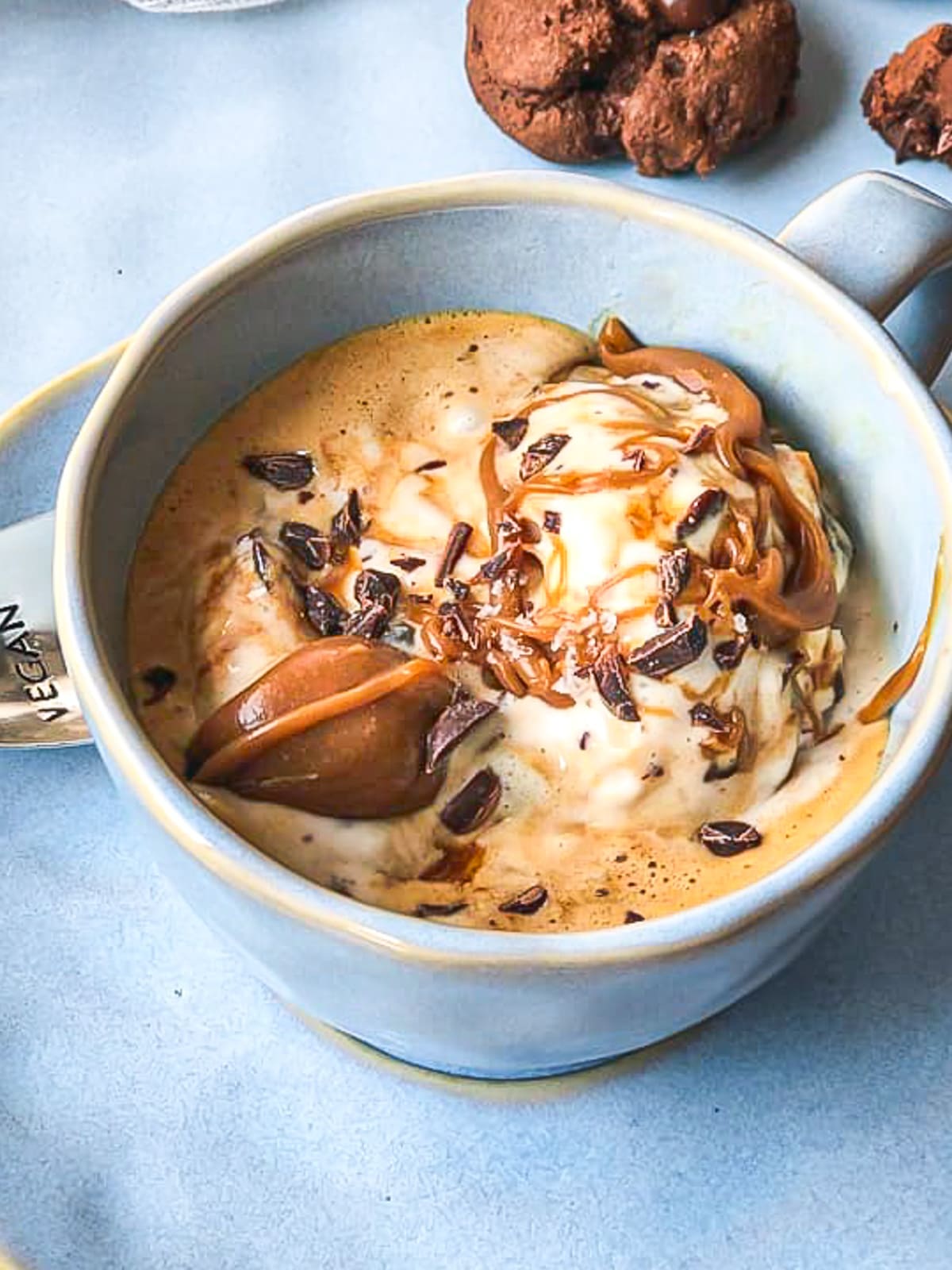 Mug of Italian Affogato topped with caramel and chocolate curls.