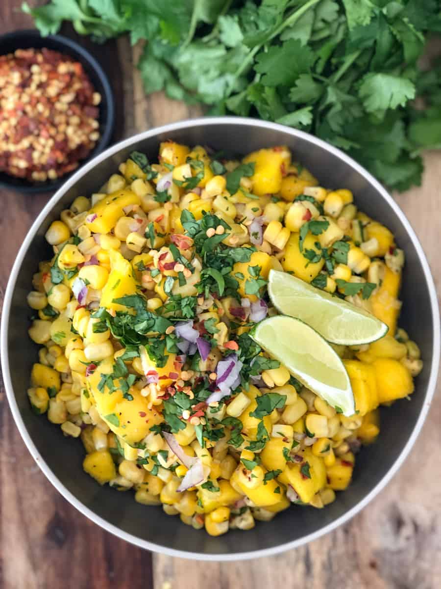 Overhead shot of a big bowl of mango corn salsa.