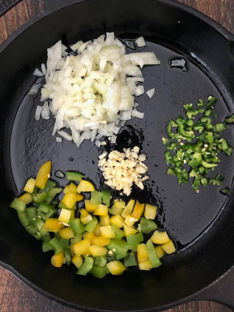 Corn fritter ingredients in a skillet.