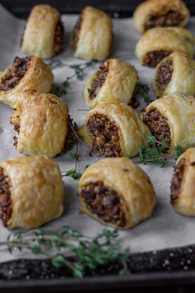 Vegan vegetarian sausage rolls on baking sheet.