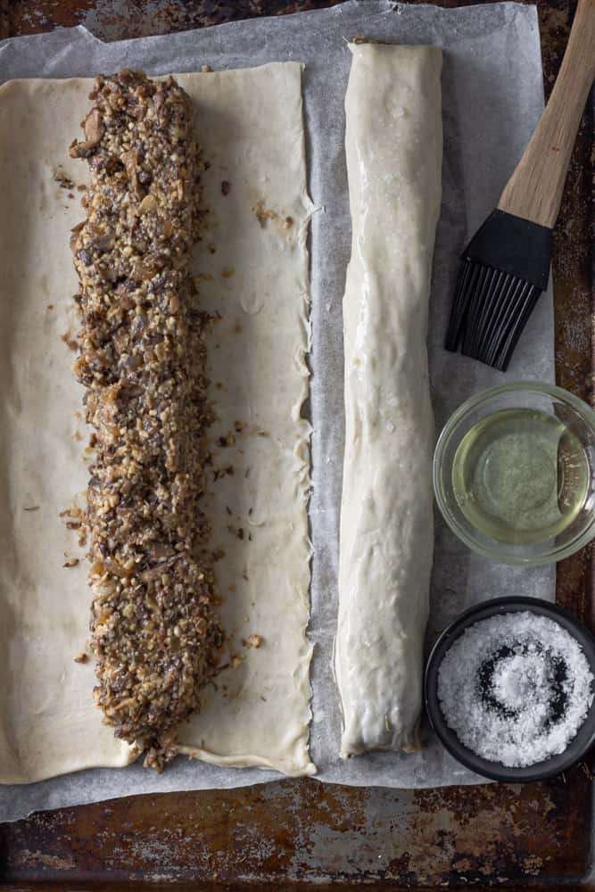 Mushroom filling on puff pastry ready to be rolled.