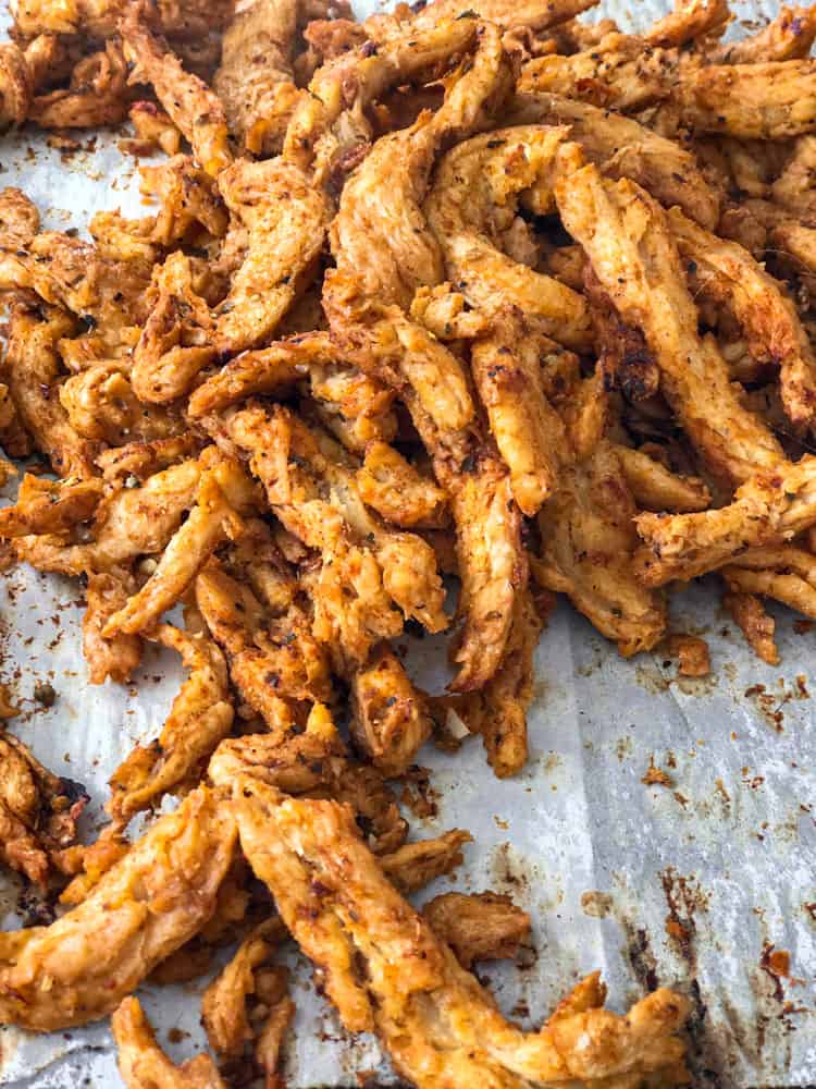 Vegan chicken replacement soy curls on baking sheet.