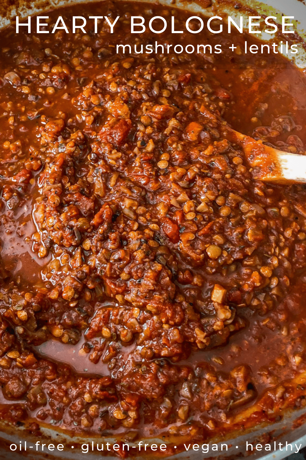 Close up of lentil bolognese sauce simmering in a pot.