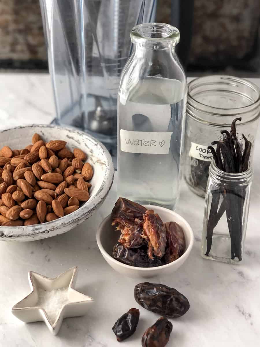 Ingredients for almond milk displayed on counter top.