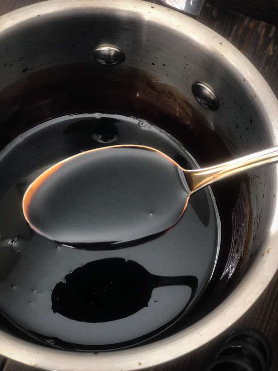 Close up of balsamic vinegar reduction in a saucepan.