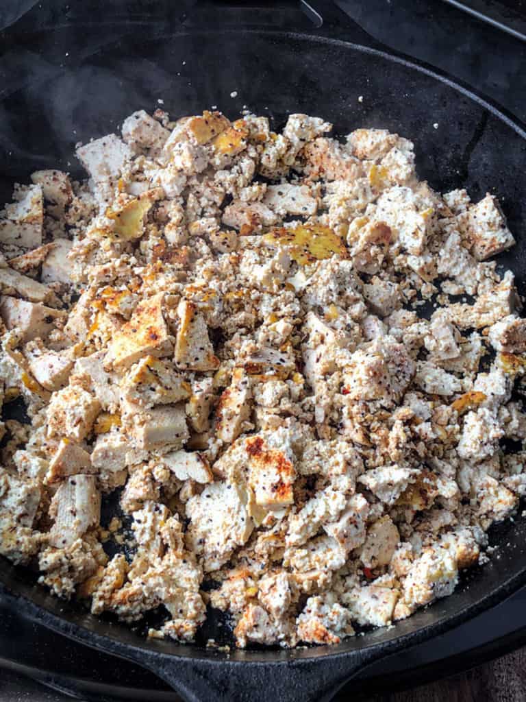 Skillet full of spiced tofu crumbles filling for tacos.