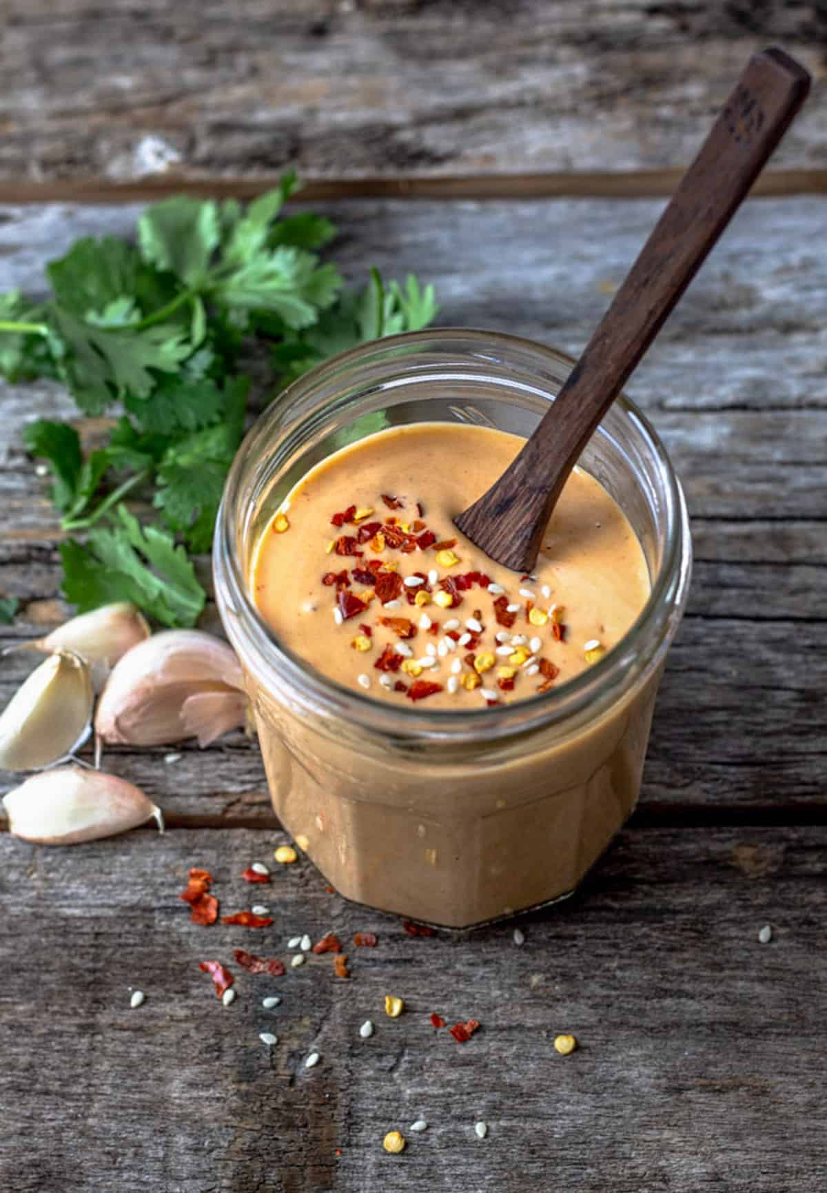 Sweet and spicy tahini sauce in a jar.