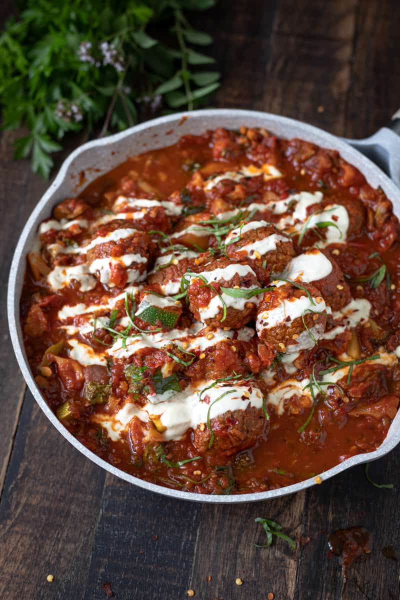 Skillet with creamy tomato sauce.
