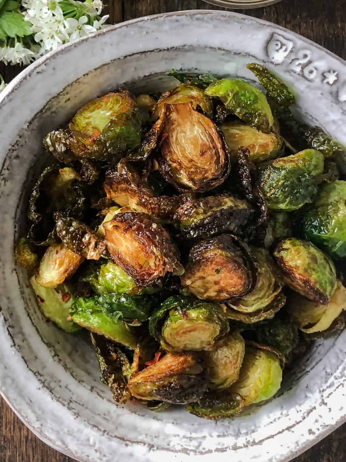 Bowlful of crispy fried Brussel sprouts.
