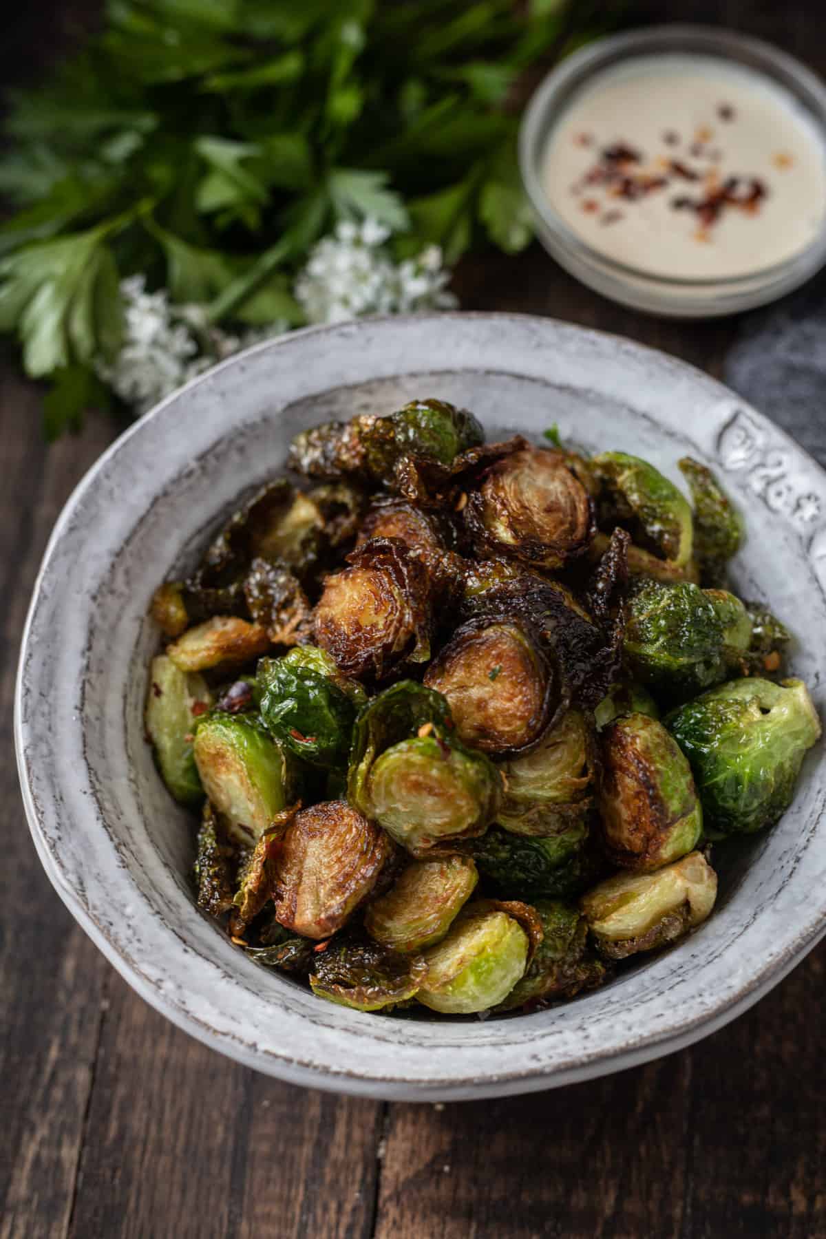 Bowlful of crispy fried Brussels sprouts.