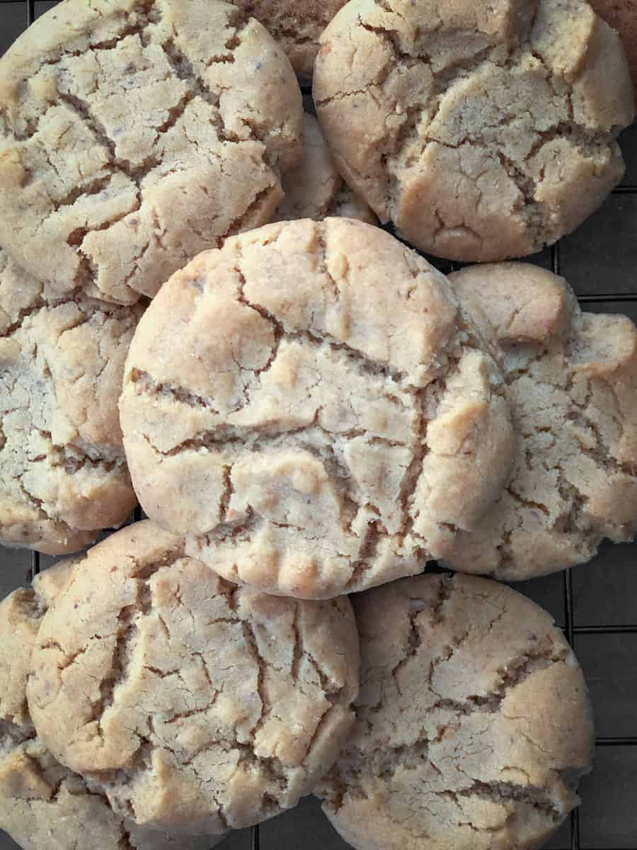 Peanut butter cookies cooling on a baking rack.