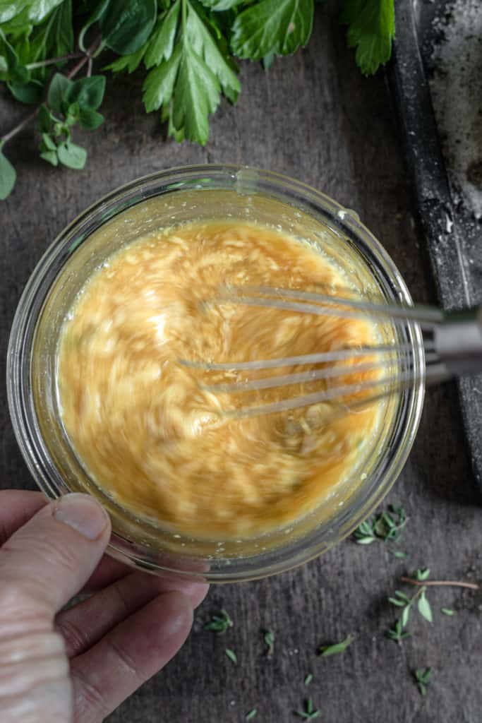 Bowl of honey mustard sauce being whisked.