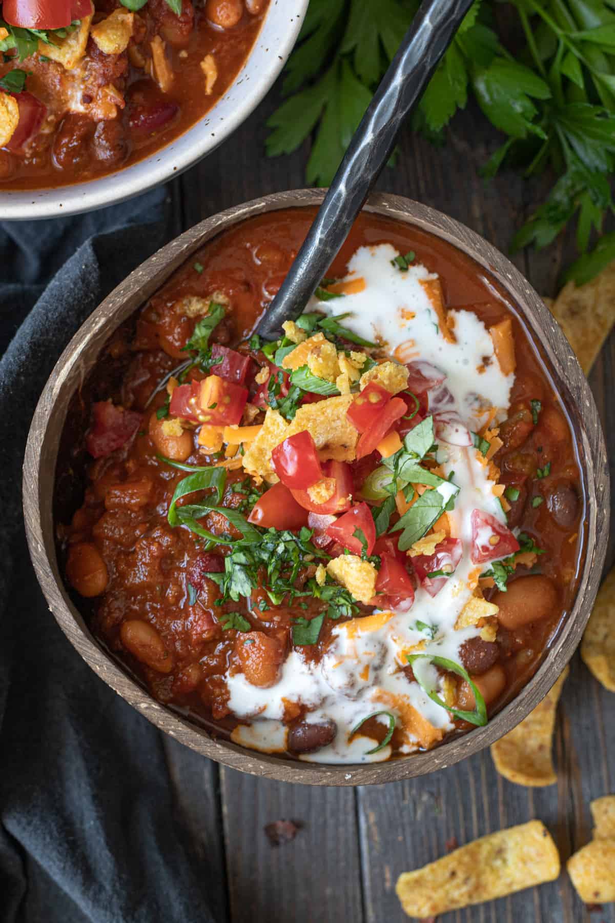 Bowlful of vegan bean and Beyond meat chili with sour cream swirl.