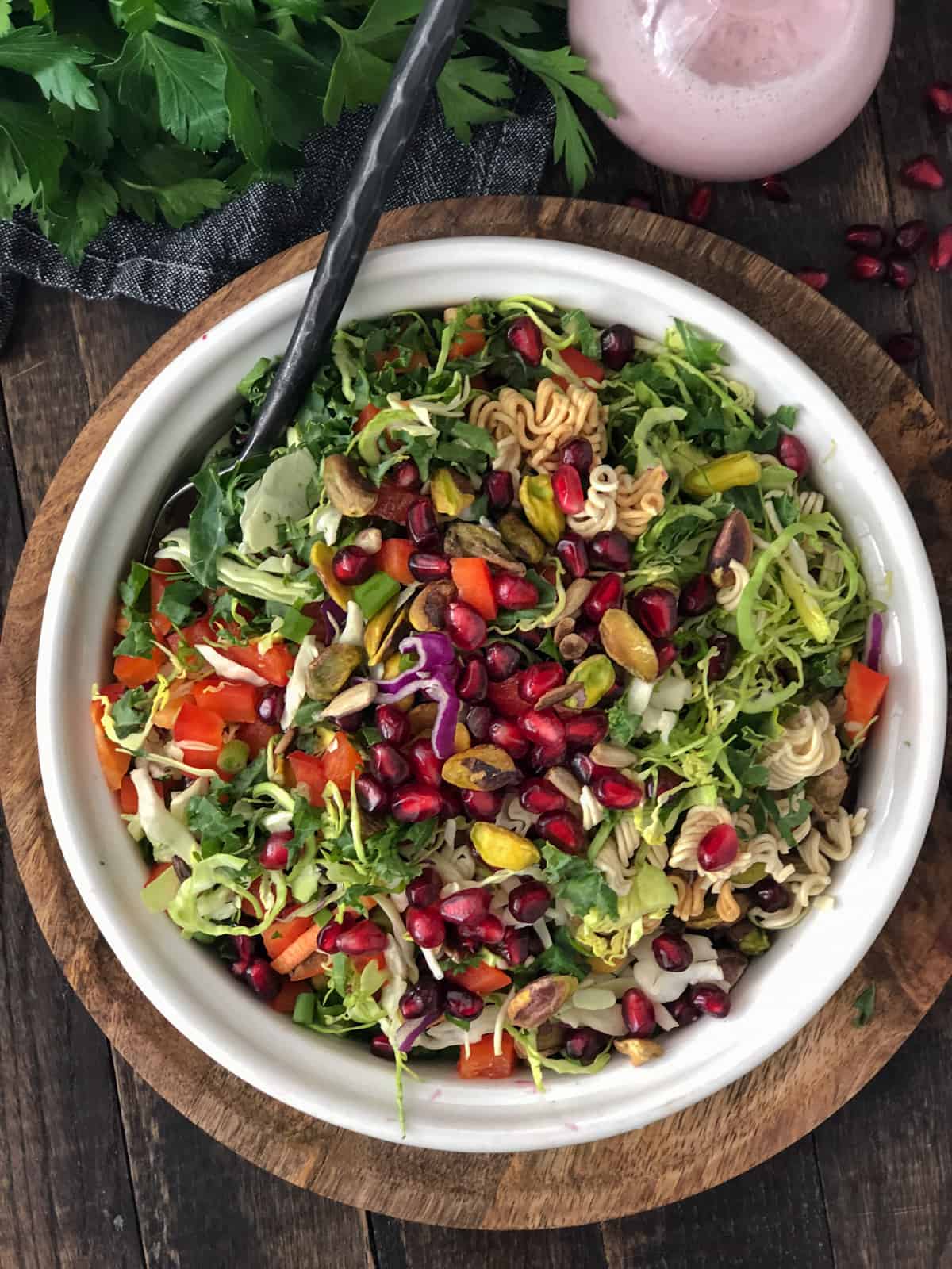 Brussel sprouts slaw with pomegranates, pistachios and red peppers.
