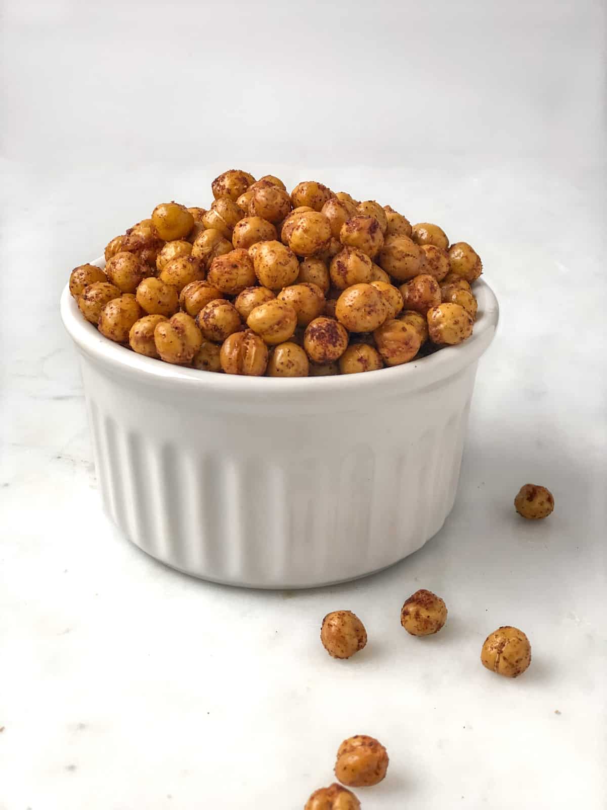 Crisp seasoned chickpeas piled up in a dish.