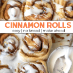 Tray of cinnamon rolls and bowl of icing with spoon.