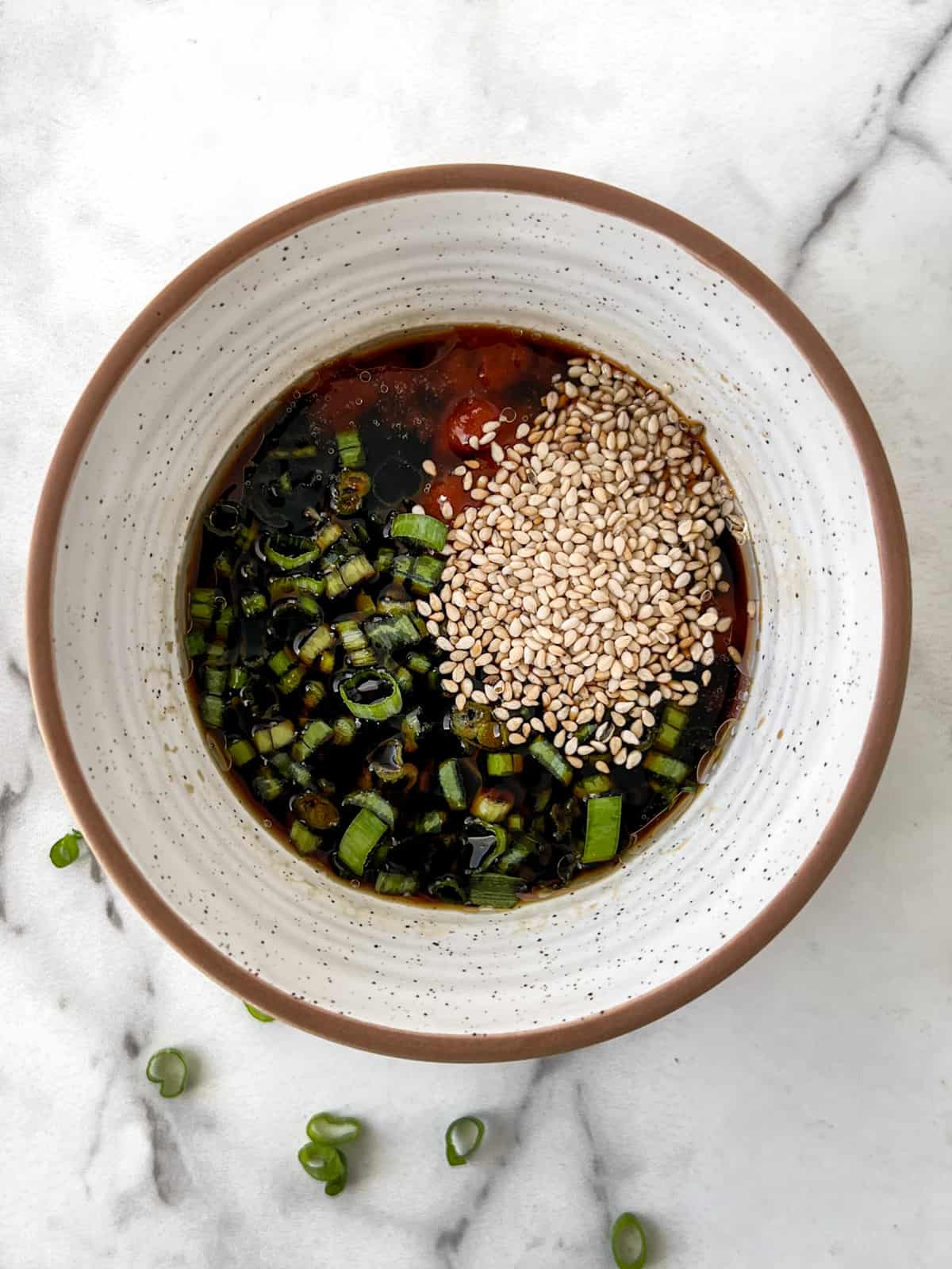 Bowlful of potsticker dipping sauce ingredients.