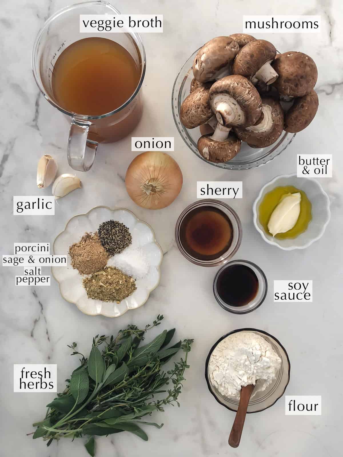 Ingredients for mushroom gravy in bowls on a counter.