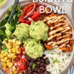 Burrito bowl made with guacamole, rice, black beans, red pepper and onions, corn, and sweet potatoes.