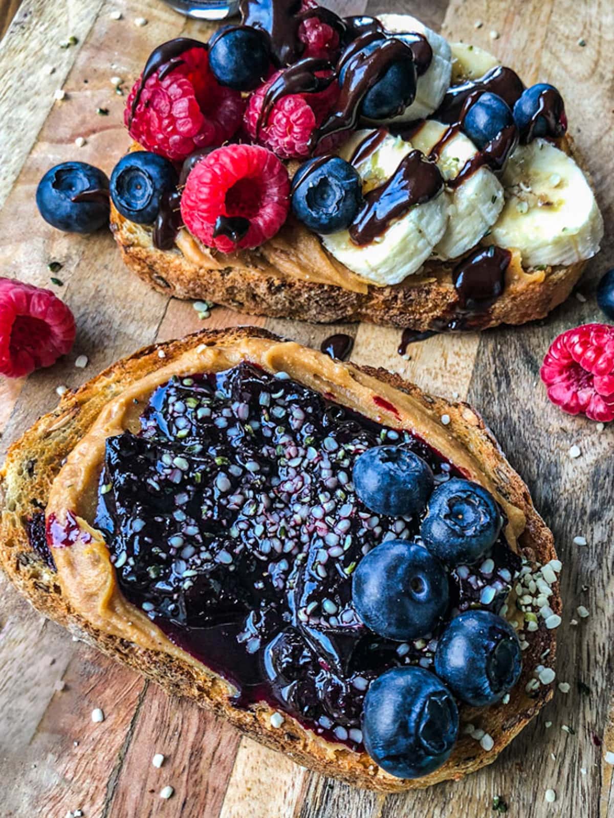 Sourdough toast with peanut butter, jam, and fresh fruit.