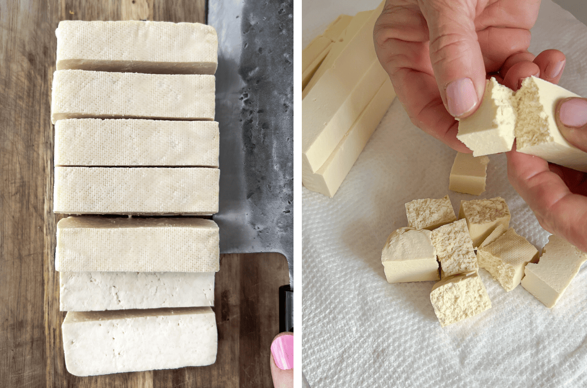 Tofu cut into batons and being torn into cubes.