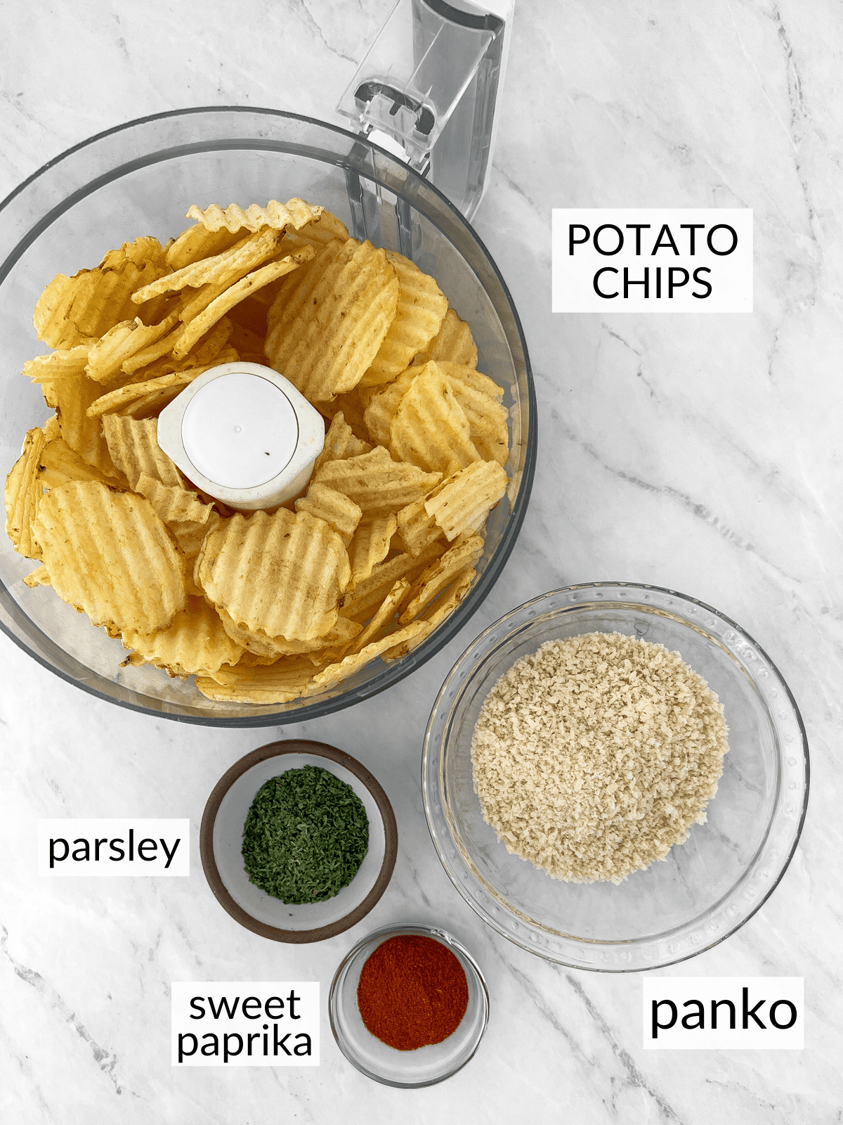 Individual bowls of potato chips, panko, dry parsley and paprika.