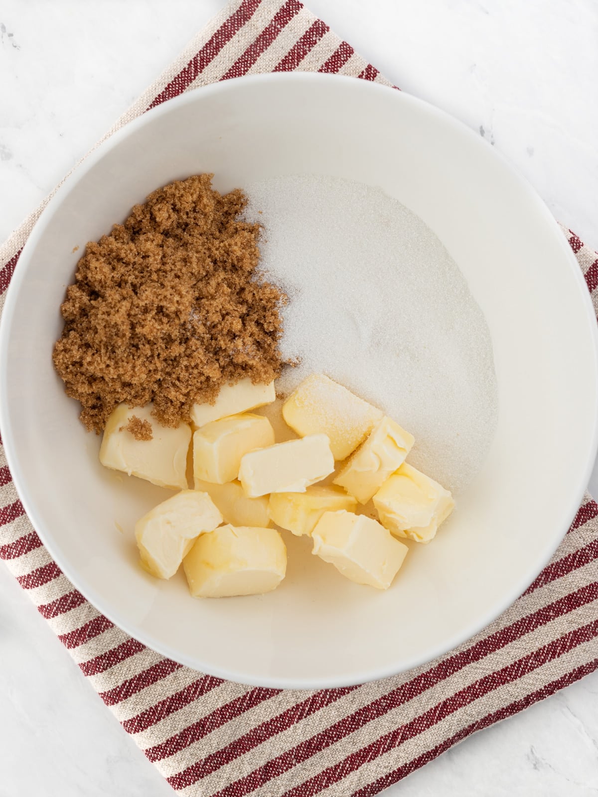 Vegan butter, brown sugar and white sugar in a mixing bowl.