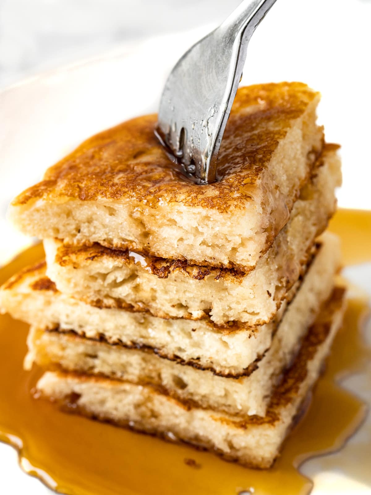Forkful of fluffy buttermilk pancakes.