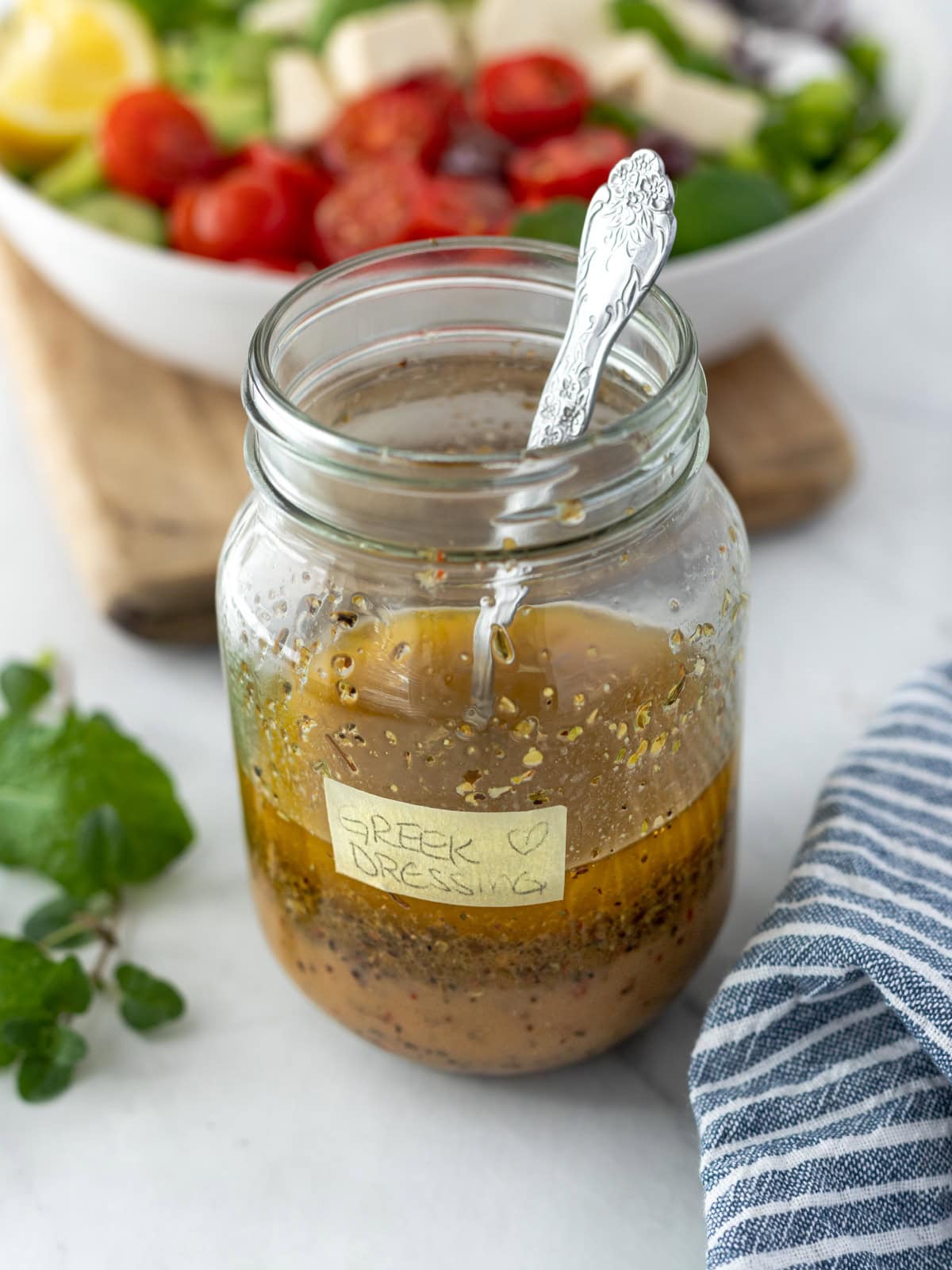 Jar of vegan Greek salad dressing.