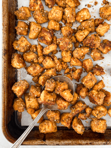 Vegan Tofu Sausage crumbles on a baking sheet.