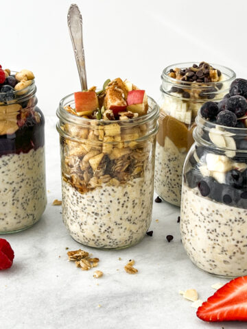 Overnight oats in jars with fresh fruit toppings.